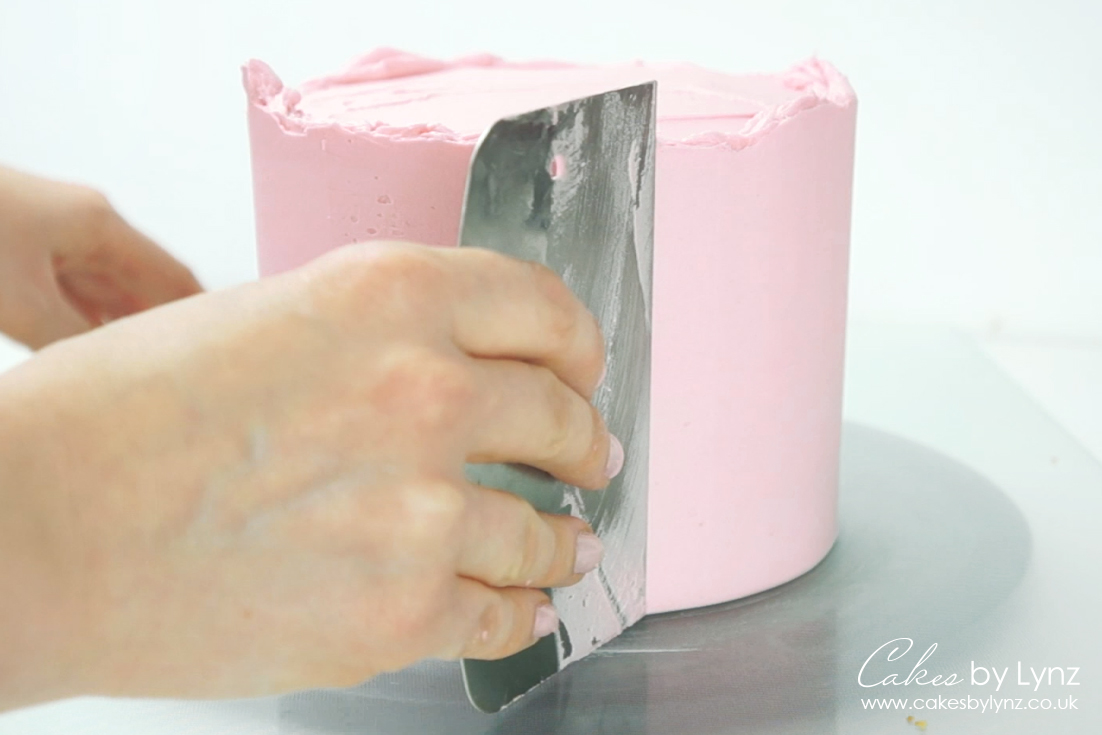 Frosting a cake with buttercream