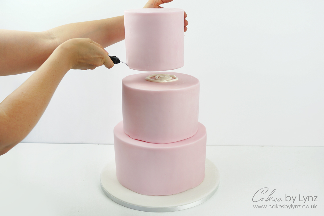 stacking a tiered cake